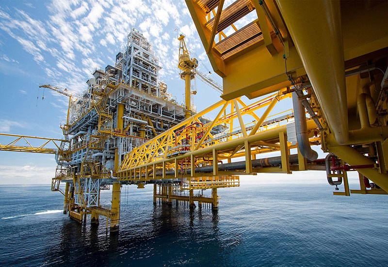 Engineering professionals working at an offshore facility